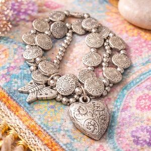 Elegant Silver Heart and butterfly Charm stretch Bracelet. Good quality/weight
